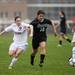 Dexter freshman Hannah Tarnaski and Huron junior Kelsey Trulik battle for possession of the ball on Tuesday, April 23. Daniel Brenner I AnnArbor.com